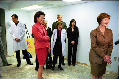 Laura Bush takes questions from members of the media following a tour of the Capital Breast Care Center with Ambassador Nancy Brinker, founder of the Komen Foundation for Breast Cancer, in Washington, D.C., March 9, 2004.